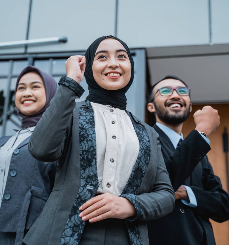 excited-muslim-businesswoman-wearing-hijab-raise-their-arm-showing-success-winning-gesture (2) (1)